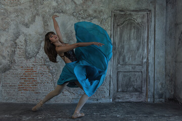 woman in a dress. young ballerina with a perfect body is dancing in a photo studio, dancers are dressed in fashionable outfits, this picture is taken in minimal style, showing the beauty of classical  © ENGINEER - STUDIO