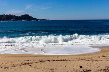 A view on Pacific ocean with blue water and waves