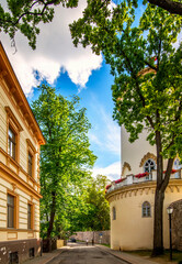 Narrow street with old and medieval buildings in  European town