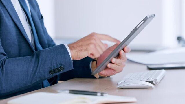 Closeup hands of a business man using digital tablet. Formal guy checking statistics, finance, buying and selling while trading online. Male manager browsing internet watching trends in the market.
