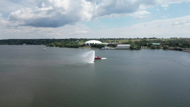 Aerial view of a fire boat doing a test  in open water