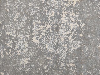 Peeled concrete texture wall with grunge for abstract background.Vintage and retro backdrop Sepia toned.Dark Old Dirt Cracked Surface Soil Ground Rusty Decay Broken Distorted.