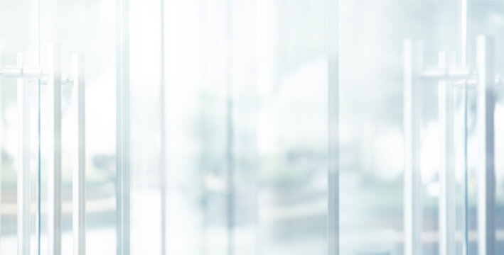 Blurred images of glass wall with city town background.modern abstract window