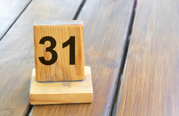 Wooden priority number 31 on a plank tab