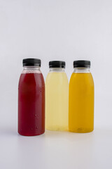 Fruit and vegetable juice bottles isolated on white background