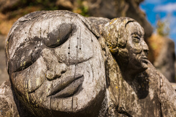 Wood carving in the shape of a head of a woman in Jack Point and Biggs Park, BC Canada