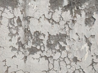 Obraz premium Peeling Grunge Wall Texture.Patched and Deteriorating Wall.Rusty and Dilapidated Wall Surface.Chipped and Peeling Plaster Texture.Cracked and Textured Cement Wall.Rough and Flaking Mortar Texture.
