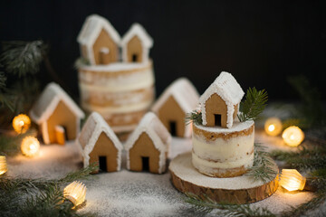 Fototapeta na wymiar Gingerbread Christmas houses sprinkled with powdered sugar