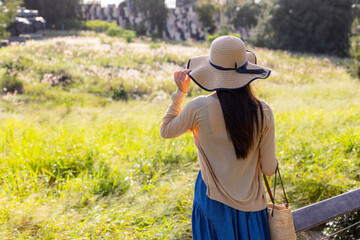 Travel woman look at the greenery view under sunset