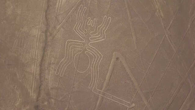 Aerial view of Nazca Lines - Spider geoglyph, Peru. The Lines were designated as a UNESCO World Heritage Site in 1994.