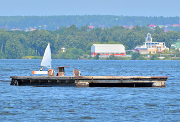 Floating pier for yachts on a summer day