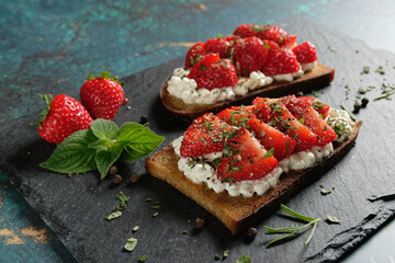 Fruity toast with strawberries on cottage cheese. Healthy toast (tartine). 