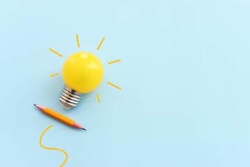 Education concept image. Creative idea and innovation. light bulb metaphor over blue background - obrazy, fototapety, plakaty