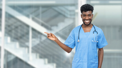 Pointing african american male nurse or medical student with beard