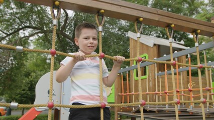 Obraz premium 4K. A child on the playground in the park