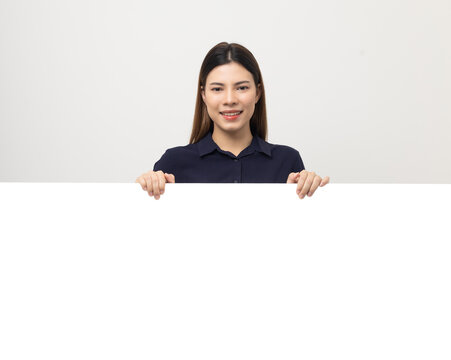 Portrait Of Young Beautiful Mixed Race Woman Standing And Smiling On Isolated White Background With Big Mockup Billboard For Advertising Text.