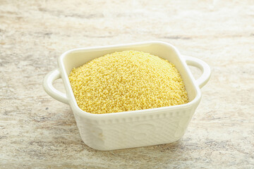 Raw couscous in the bowl