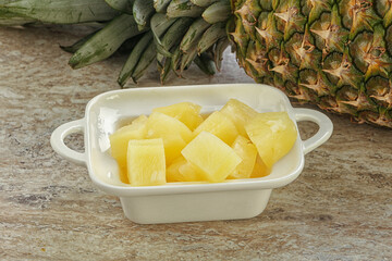 Marinated pineapple slices in the bowl
