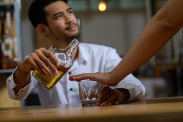 Young Asian man has been stop for drinking alcohol may be because of during quit alcohol period or...