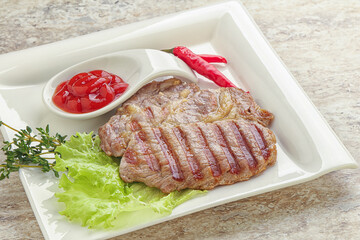Grilled pork neck steak with ketchup