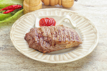 Grilled rib-eye steak beef meat
