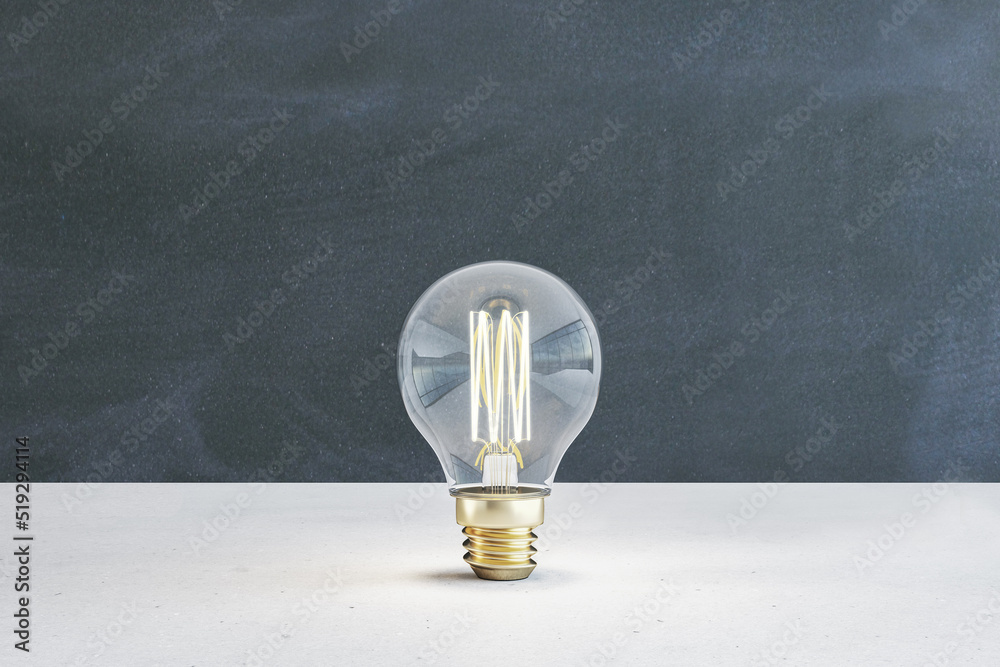 Poster Close up of illuminated light bulb with filament on blackboard wall background. New idea and innovation concept. 3D Rendering.