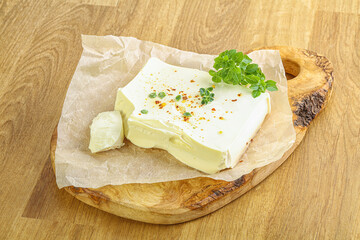 Greek Feta cheese over board