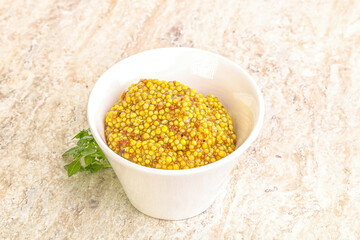 Grain mustard sauce in the bowl