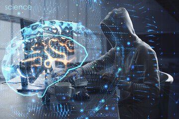 Hacker at desktop using laptop computer with creative brain hologram on blurry office interior background. Science, future, technology and AI concept. Double exposure.