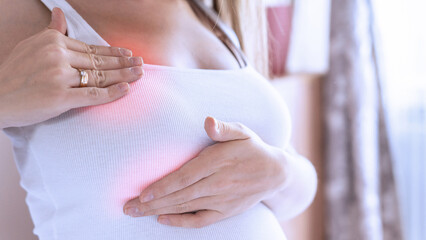 Breast pain self exam. Young pregnancy woman examining breast for signs lumps. Breast self exam....