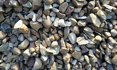 Abstract background with lot of various shape peeble stones. 