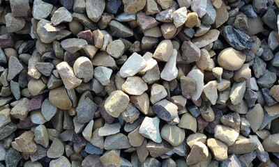 Abstract background with lot of various shape peeble stones. 