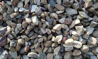 Abstract background with lot of various shape peeble stones. 