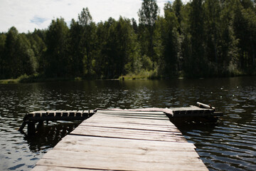 Naklejka premium Natural landscape, wooden bridge, river in the forest