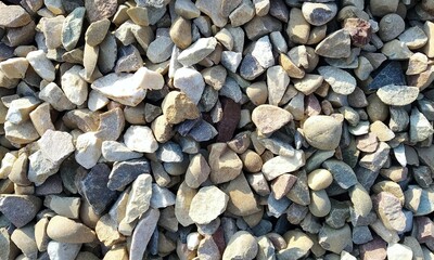 Abstract background with lot of various shape peeble stones. 