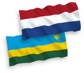 National vector fabric wave flags of Republic of Rwanda and Netherlands isolated on white background. 1 to 2 proportion.