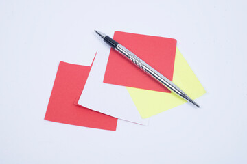 Blank Sticky Note With Laundry Clip Stack Of Colorful Paper Pen Placed On Table. 