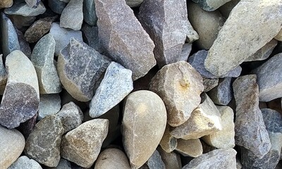 Abstract background with lot of various shape peeble stones. 