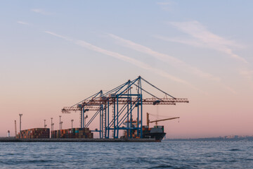 Obraz premium Loading cargo in the seaport. Marine industrial trade port. Black Sea. Export and import by sea. City of Odessa, Ukraine