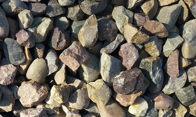 Abstract background with lot of various shape peeble stones. 