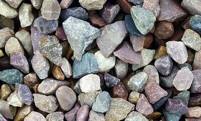 Abstract background with lot of various shape peeble stones. 