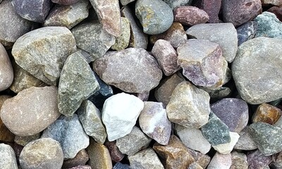 Abstract background with lot of various shape peeble stones. 