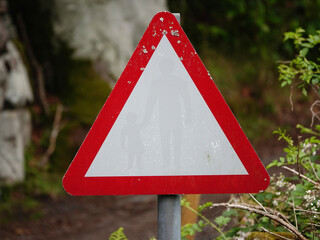danger warning sign triangle on a road