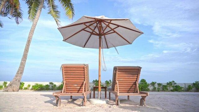 Twp Sunbeds Under Parasol on White Sand and Tropical Beachfront