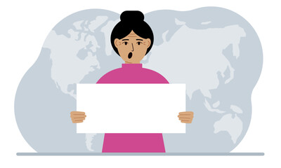 The concept of world attention. A woman holds a white poster in his hands against the background of a world map.