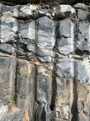 View of a textured marble rock wall in an Italian quarry