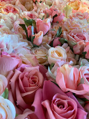 Close up of colorful imitation or artificial rose flower background.