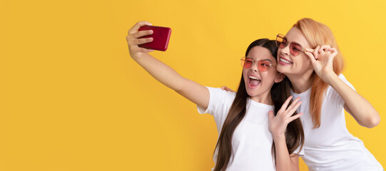 Mother and daughter child banner, copy space, isolated background. mobile technology. having video call. mother and daughter vlogging. online communication.