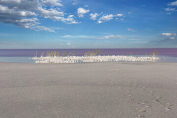 Dried salt lake layer of salt, blue sky and clouds