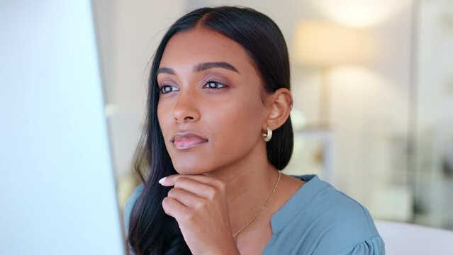 Business analyst thinking, reading or analysing data on computer to predict financial profit, loss or plan strategy. Content businesswoman nodding in agreement over progress statistics on technology